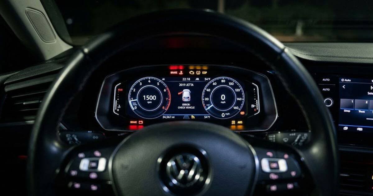 2019 VW Jetta instrument cluster with multiple warning lights illuminated