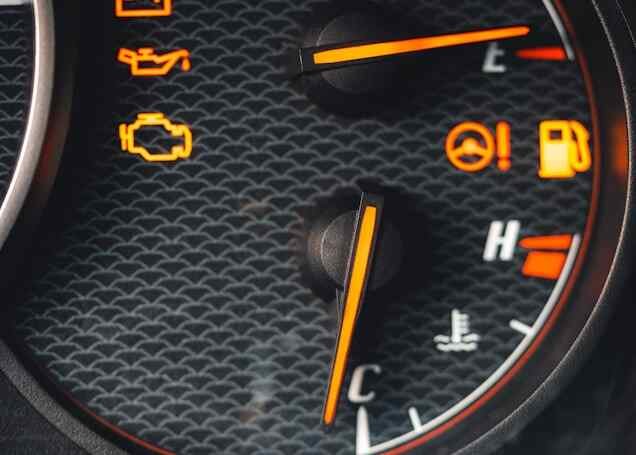 Dashboard warning lights glowing orange