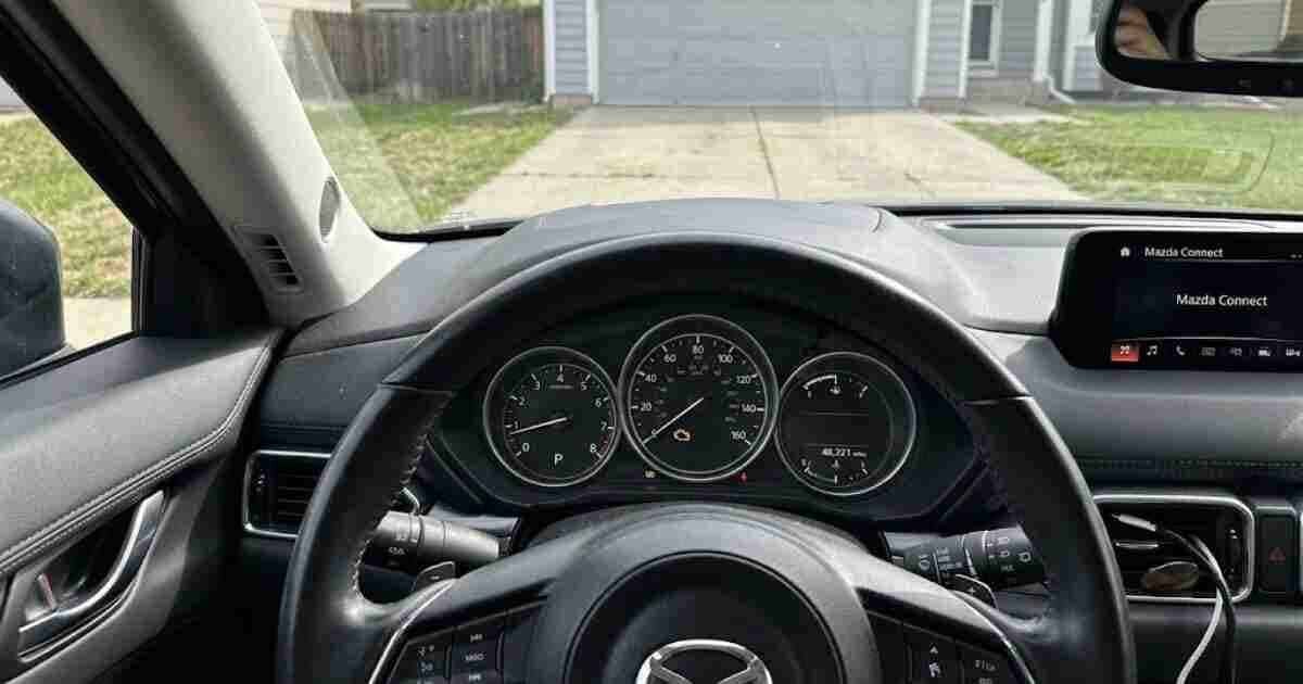 Mazda check engine light illuminated on the instrument cluster