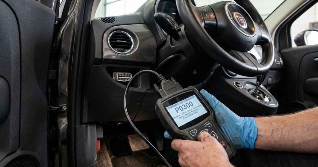 OBD-II scanner diagnosing Fiat 500 check engine light